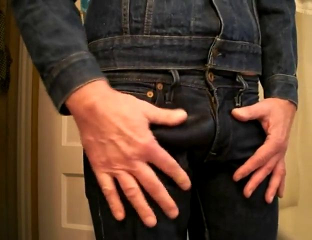 Men pissing pants jeans