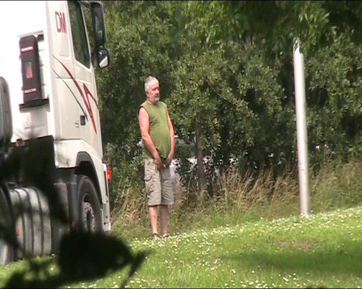 Trucker caught spying while peeing images